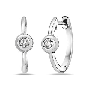 Pair of silver hoop earrings with clear gemstones on a white background
