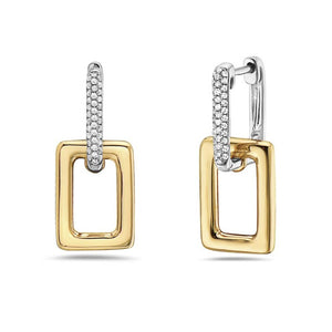 Gold and silver hoop earrings on a white background