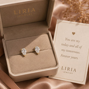Teardrop-shaped earrings in a LIRIA Jewelry box with a sentimental card.
