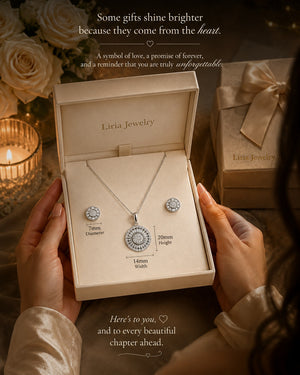 Liria Jewelry necklace and earrings set in a box with romantic text and roses in the background.