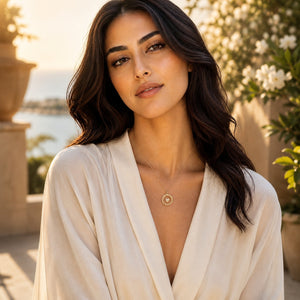 Woman wearing a white robe with a scenic background