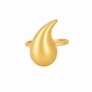 Gold ring with a unique, curved design on a white background
