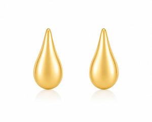 Pair of gold teardrop-shaped earrings on a white background