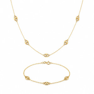 Gold necklace and bracelet set on a white background