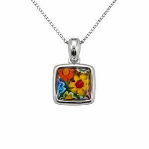 Silver pendant with colorful floral design on a white background
