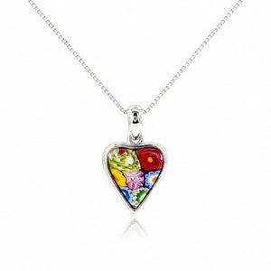 Heart-shaped pendant with floral design on a silver chain against a white background