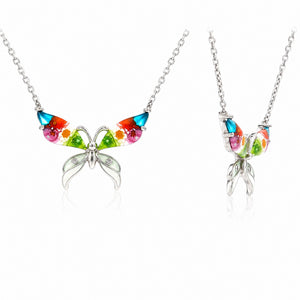Butterfly-shaped necklace with colorful gemstones on a white background