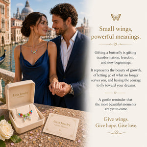 Couple holding hands with Liria Jewelry butterfly necklace against a scenic background
