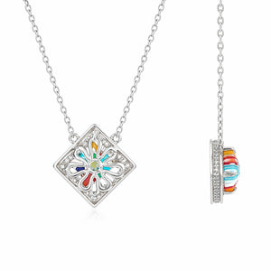Colorful flower-shaped pendant on a silver chain against a white background