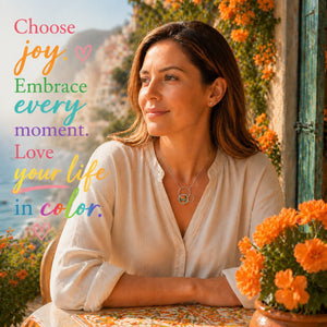 Woman sitting at a table with a scenic coastal view in the background