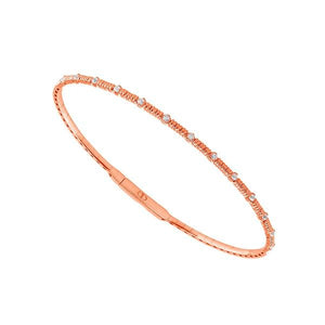 14K rose gold bangle bracelet with 13 diamond inlays and titanium center.