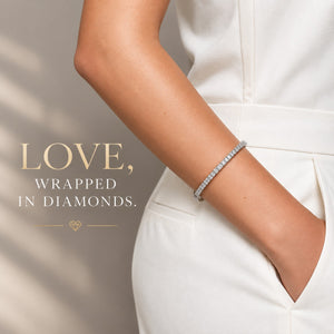 14K white gold and titanium bangle bracelet with sparkling diamond accents and a sleek, elegant design.