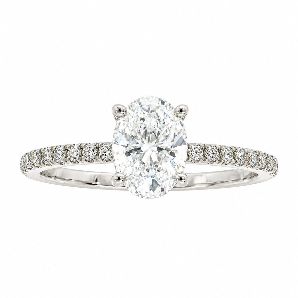 An oval diamond engagement ring with a brilliant-cut center stone in a four-prong setting, featuring a pavé band set with small round diamonds in a silver-colored metal, shown on a plain white background.