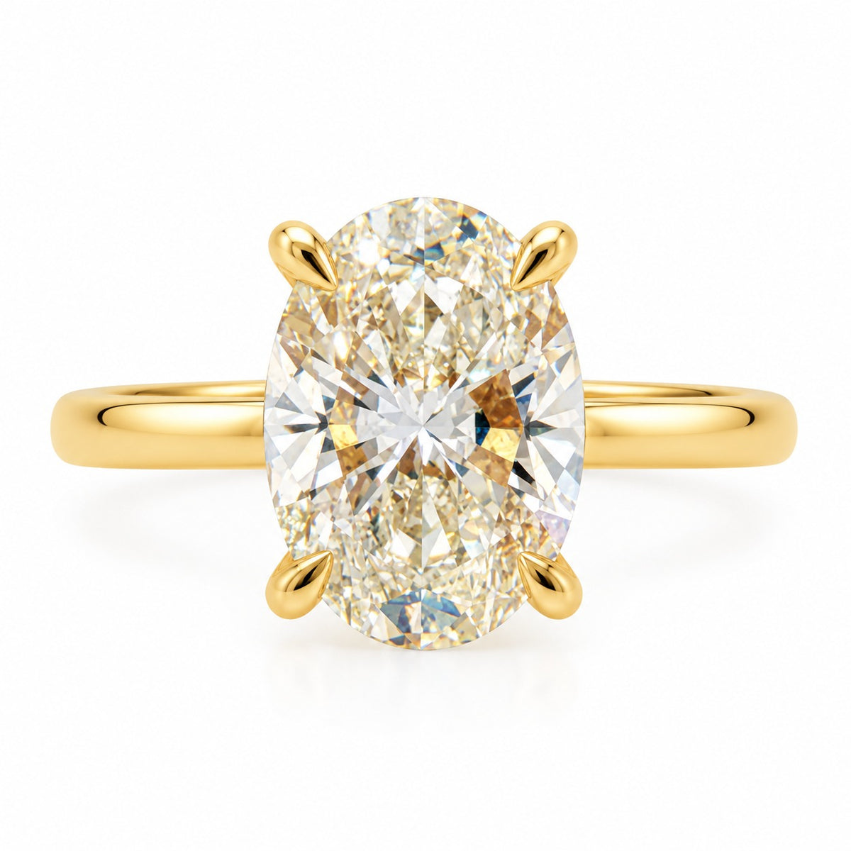 An oval diamond engagement ring with a yellow gold band, featuring a large oval-cut diamond set in a four-prong gold setting on a clean white background.