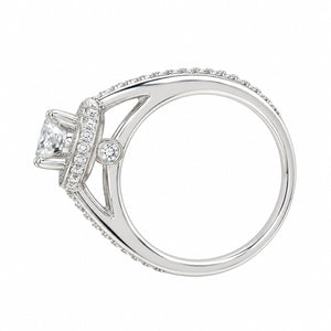 A white gold diamond ring with a square-cut center stone and pavé-set accent stones on a clean white background.