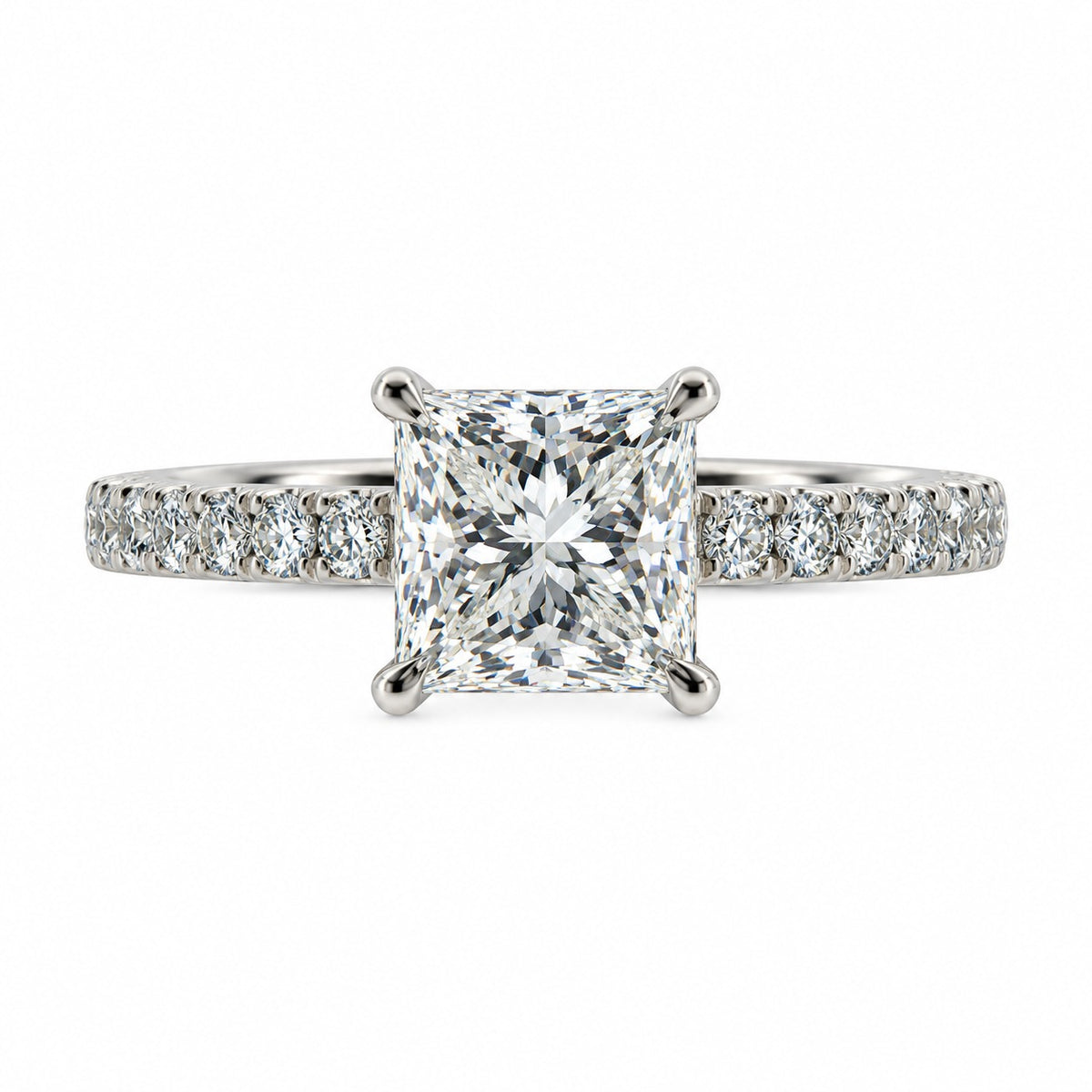 An engagement ring featuring a brilliant round-cut diamond center stone in a four-prong setting, with a pavé band set with small round diamonds, shown on a solid white background.