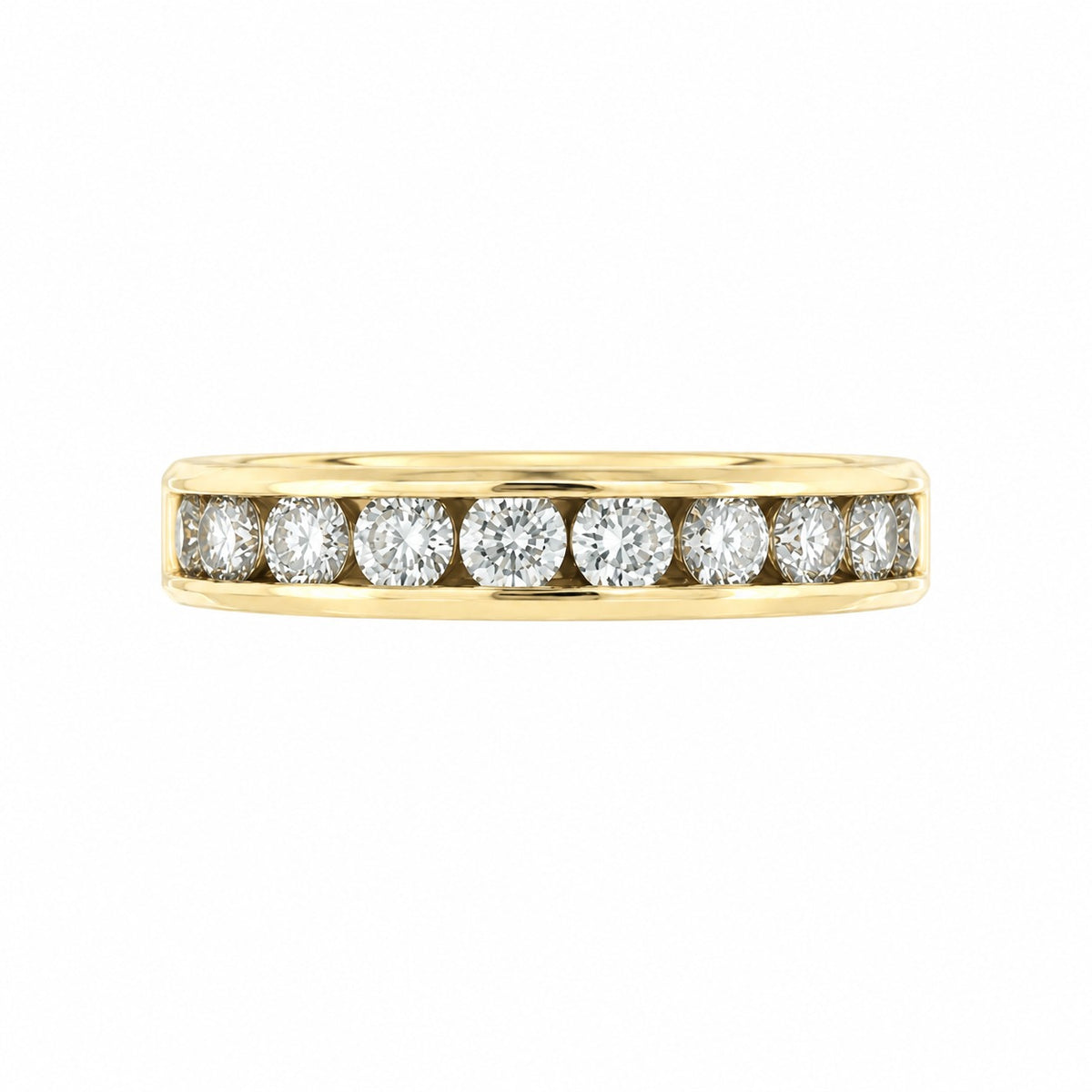 A yellow gold eternity ring featuring a row of round brilliant-cut diamonds set in a polished band, shown against a plain white background.