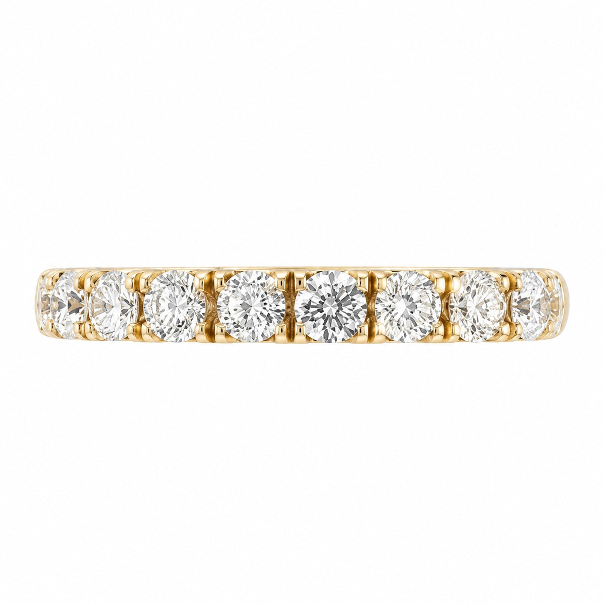 A yellow gold eternity ring featuring a row of round-cut clear gemstones, presented on a solid white background.