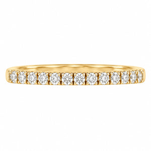 A yellow gold eternity ring featuring a continuous row of round-cut diamonds set in a prong setting, shown against a plain white background.