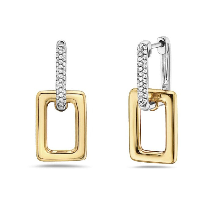 Gold and silver hoop earrings on a white background