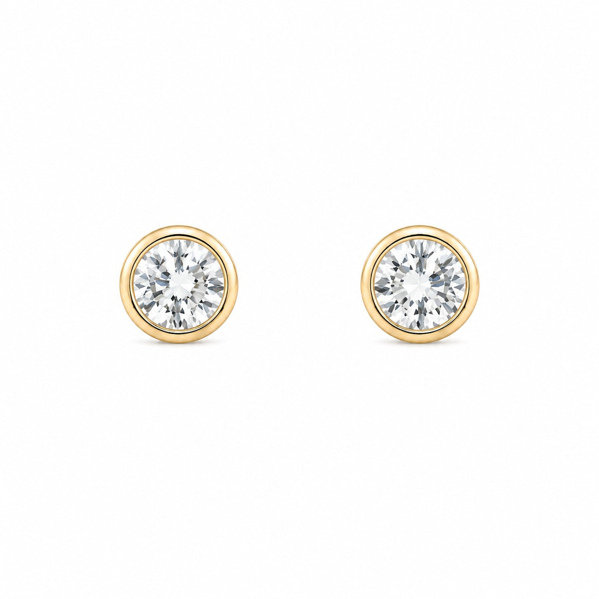 Pair of gold round diamond stud earrings on a white background