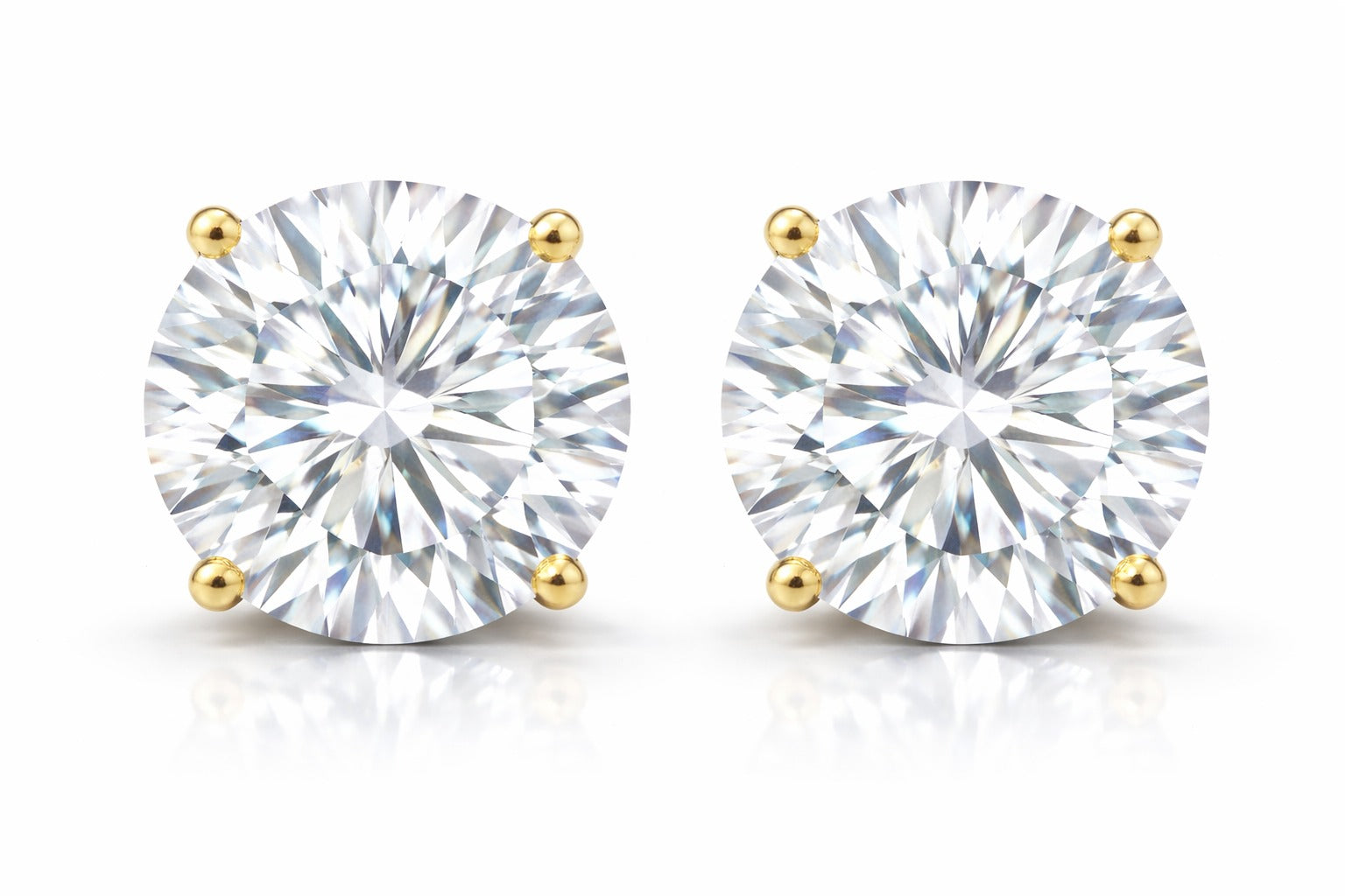 Pair of diamond stud earrings on a white background