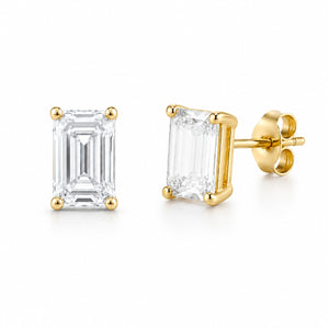 Gold emerald-cut stud earrings on a white background
