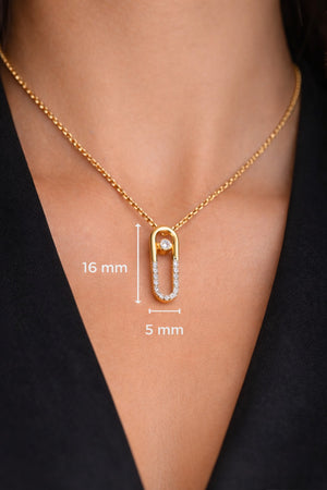 Gold necklace with a pendant on a person's neck, showing measurements.