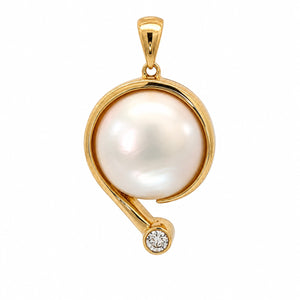 A gold pendant featuring a large, lustrous white pearl in a curved setting with a small round clear gemstone at the bottom, shown on a plain white background.