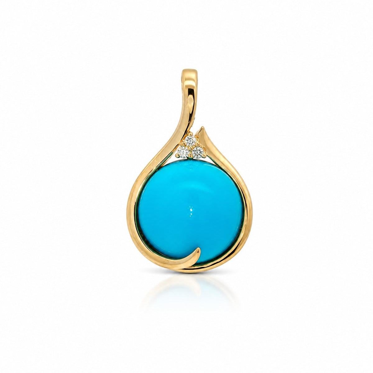 A gold teardrop pendant featuring a large, smooth round turquoise cabochon and a small cluster of clear accent stones at the top, set against a clean white background.