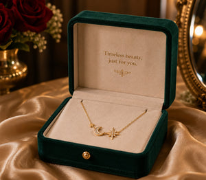 Gold necklace in a green velvet box with 'Timeless beauty, just for you.' text on a beige fabric background.