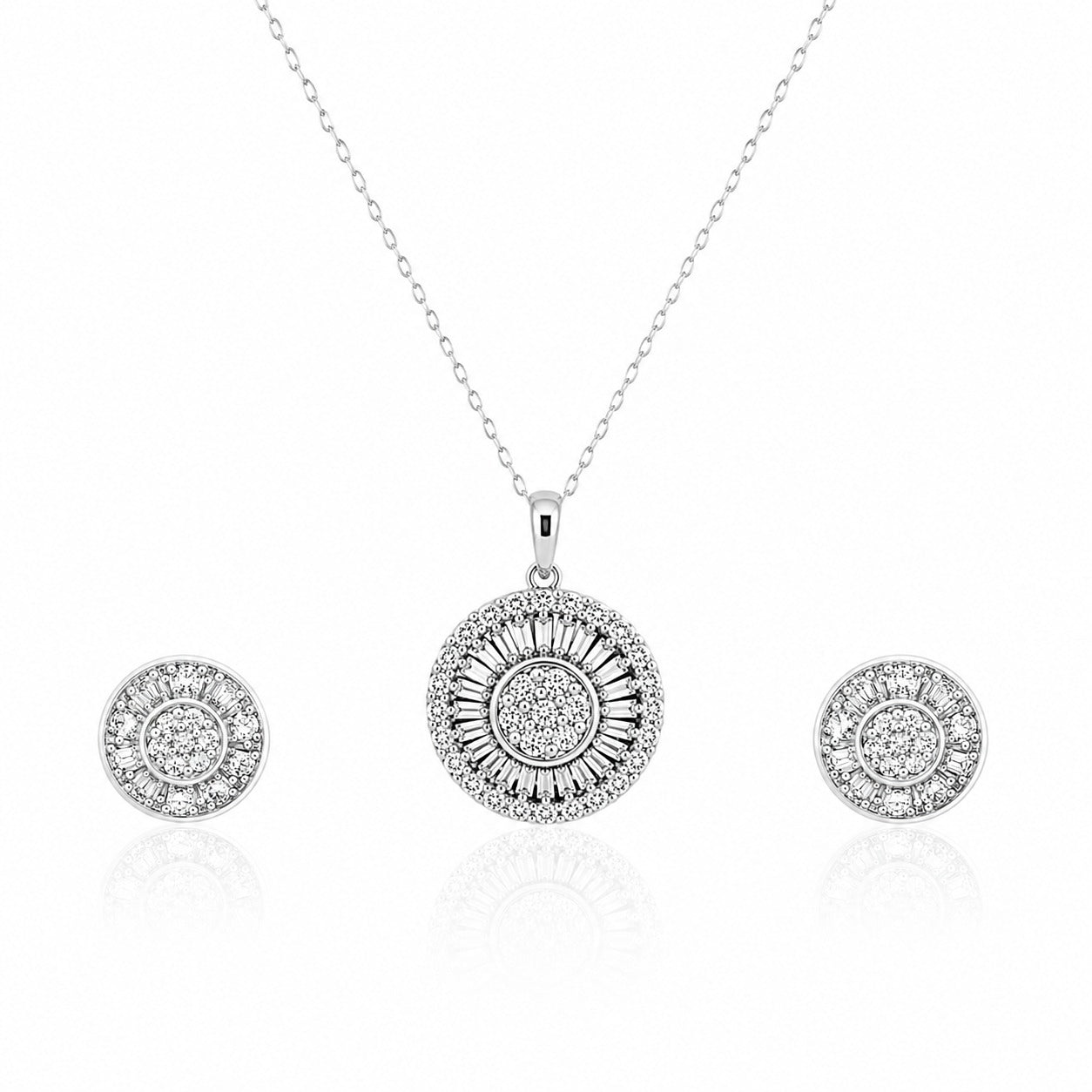 Silver jewelry set with pendant and earrings on a white background
