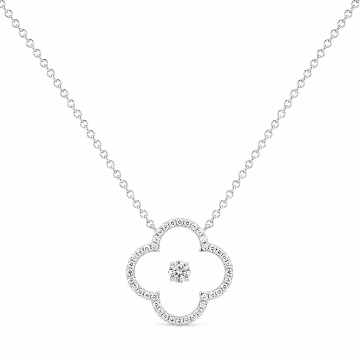 Silver necklace with a heart-shaped pendant on a white background