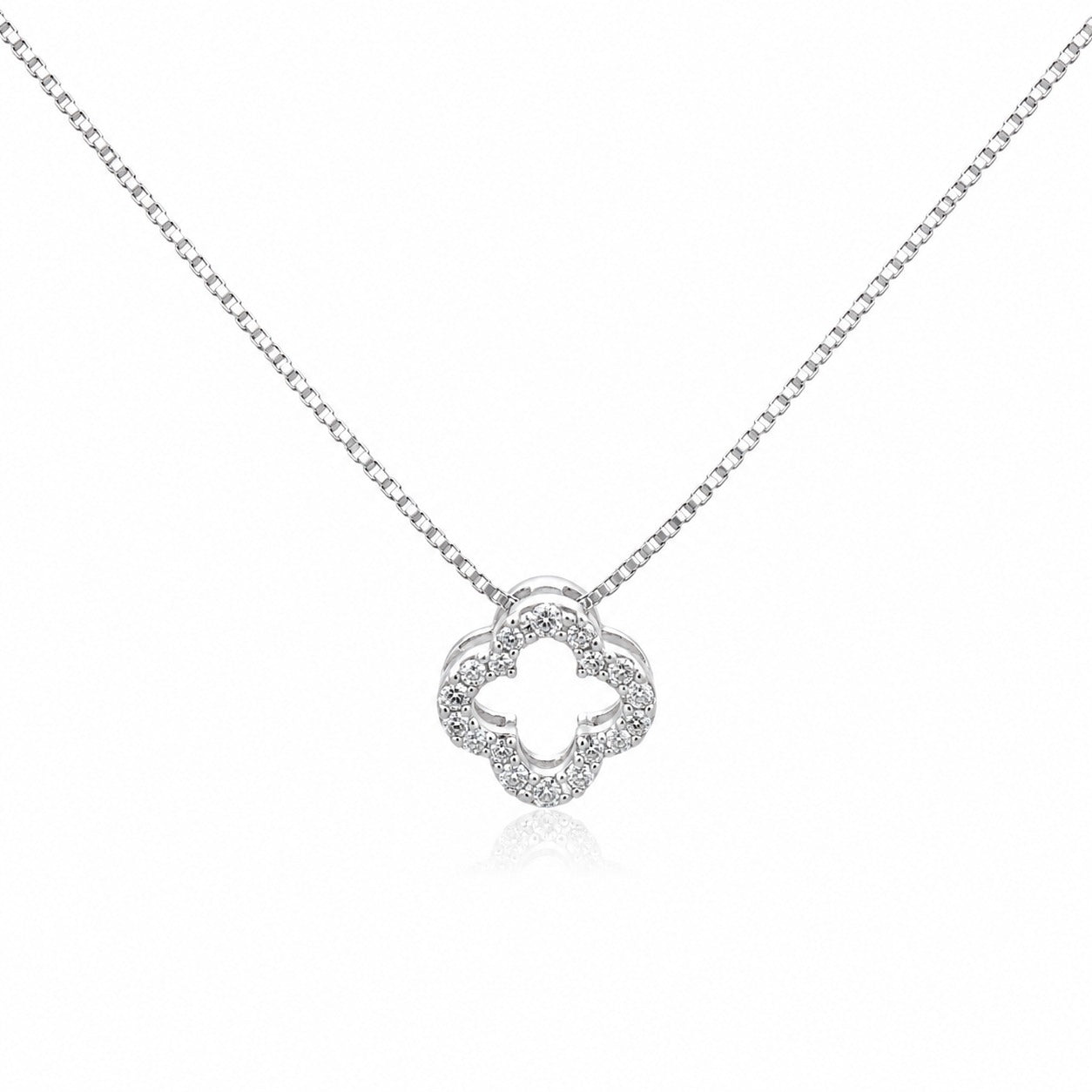 Silver necklace with a clover-shaped pendant on a white background
