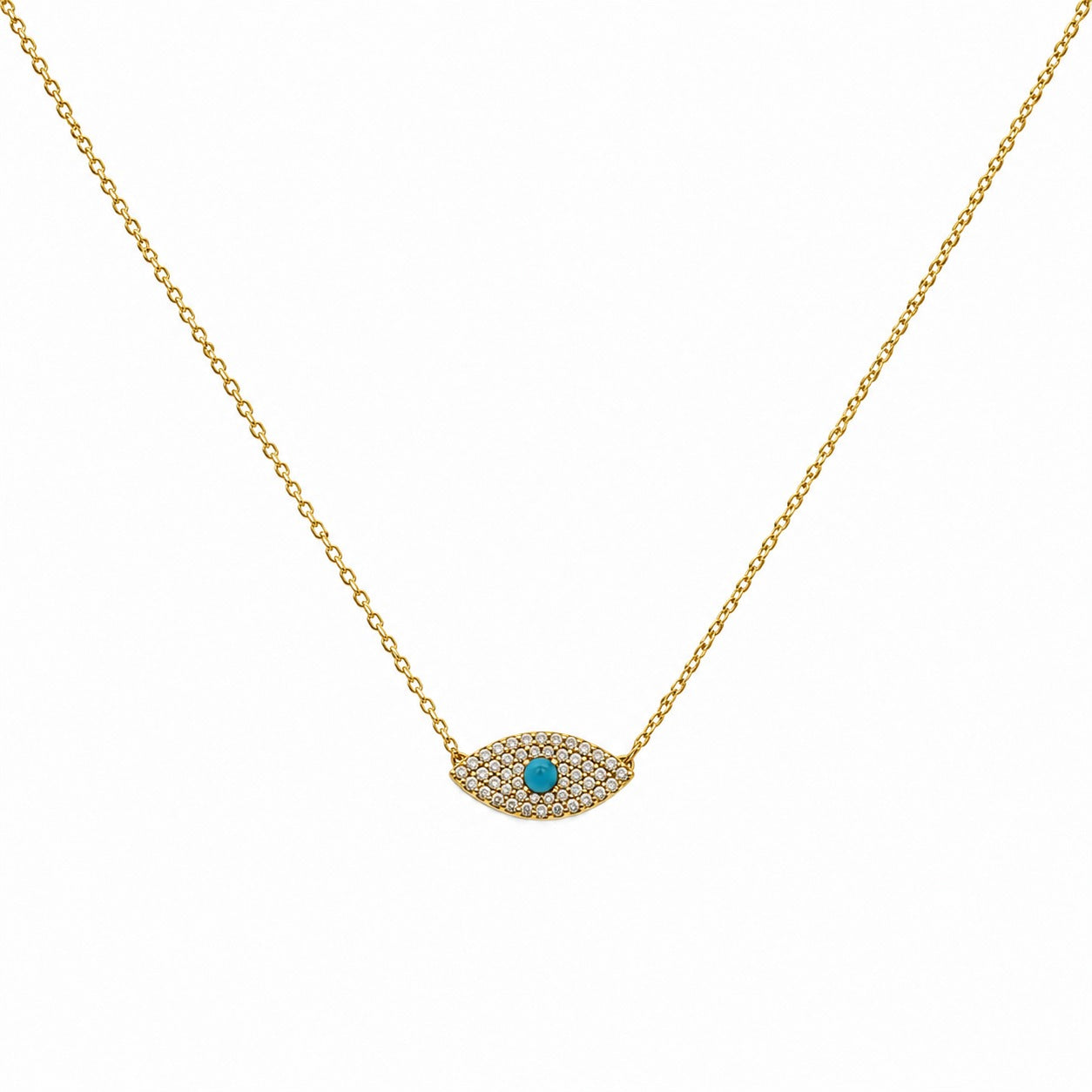 A delicate gold chain necklace featuring an evil eye pendant paved with small clear stones and a central turquoise blue gemstone, shown against a plain white background.