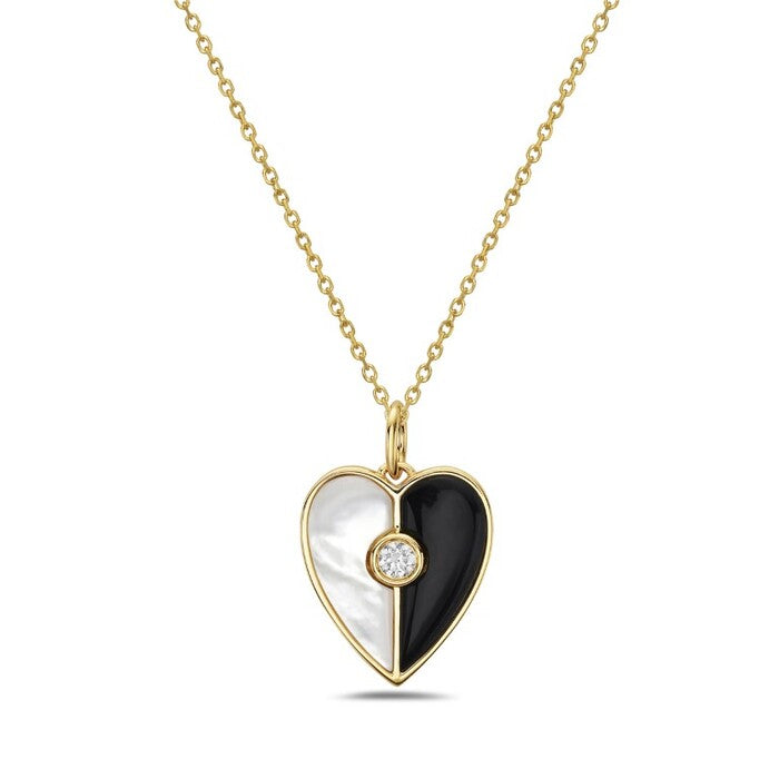 Heart-shaped pendant with gold frame, black and white center, and diamond on a white background