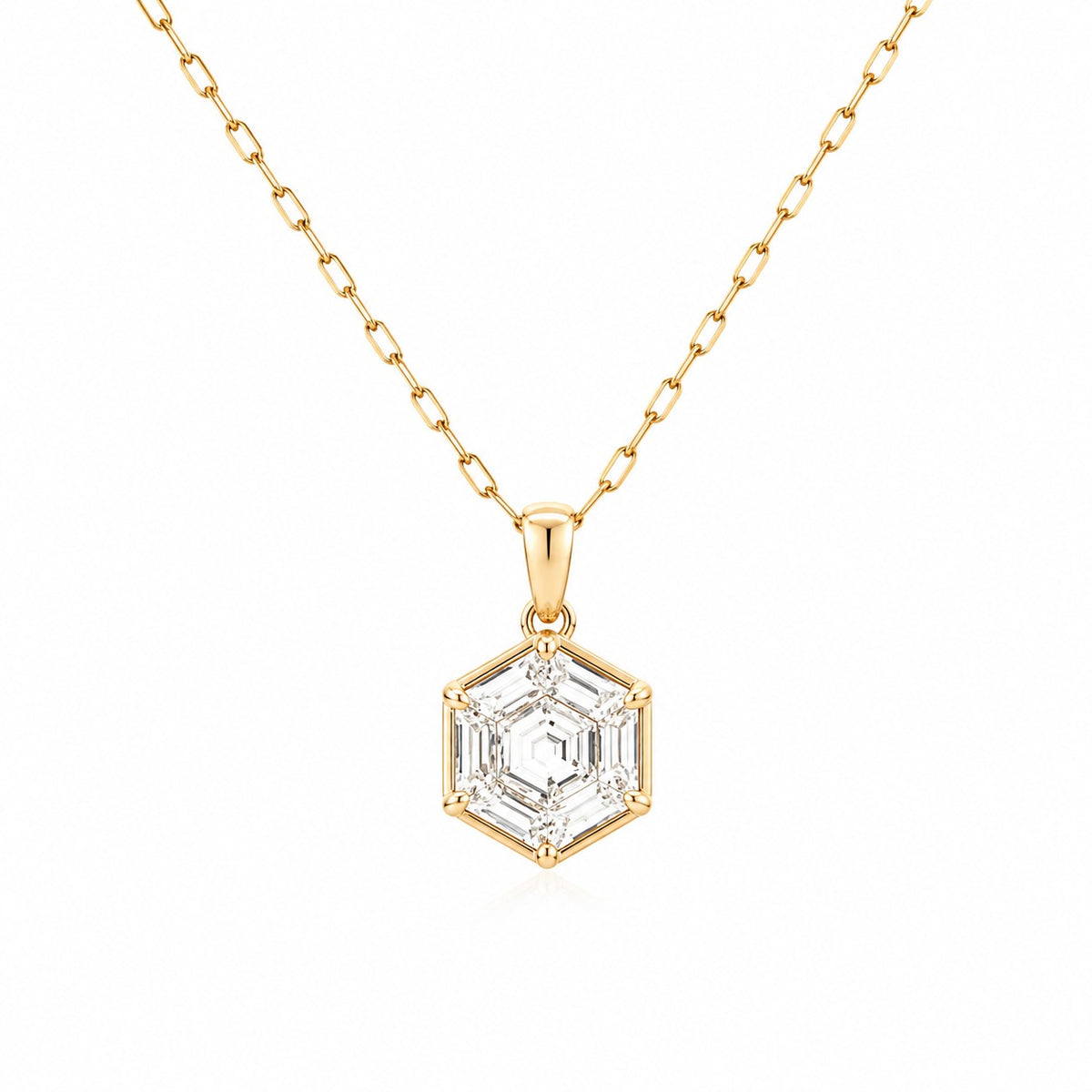 Gold necklace with a hexagonal diamond pendant on a white background