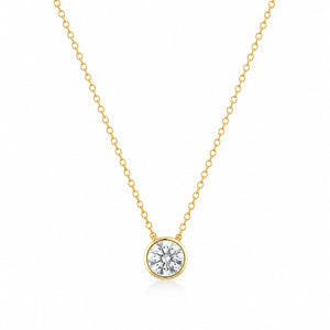 Gold necklace with a round diamond pendant on a white background