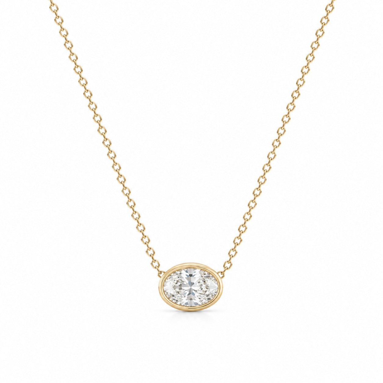 Gold necklace with a diamond pendant on a white background
