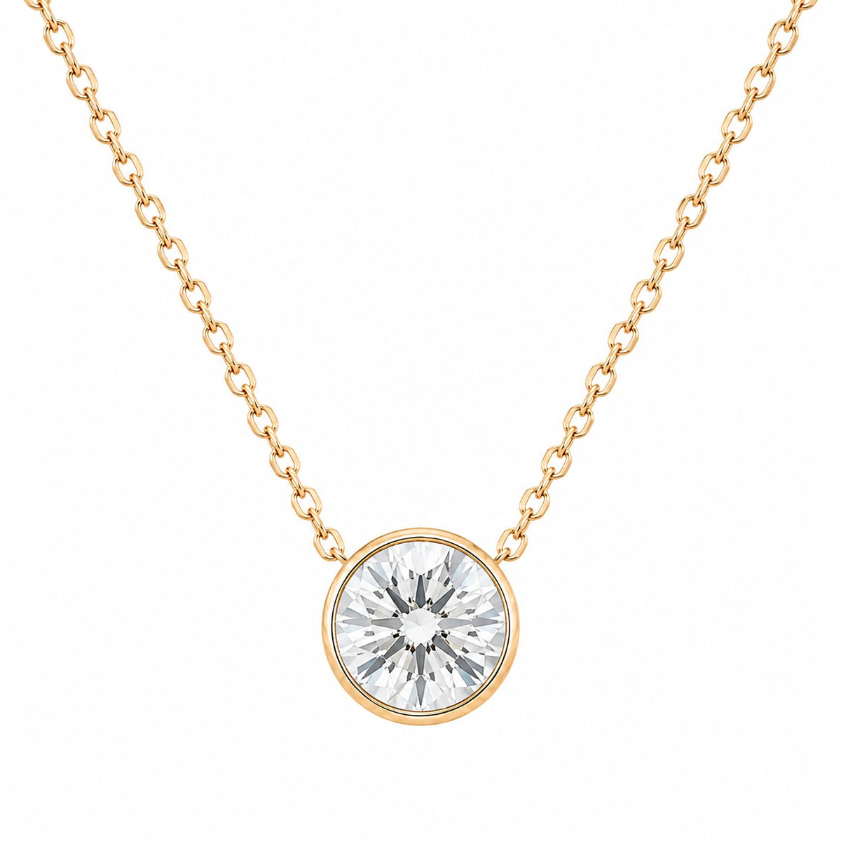 Gold necklace with a round diamond pendant on a white background