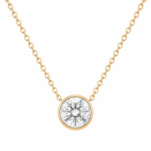 Gold necklace with a round diamond pendant on a white background