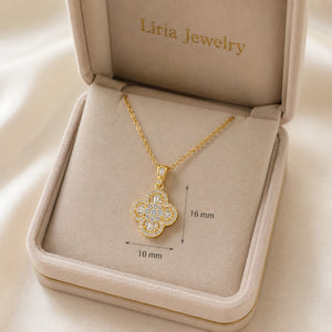 18K yellow gold four-leaf clover pendant necklace featuring brilliant round and baguette-cut diamonds on a delicate gold chain.