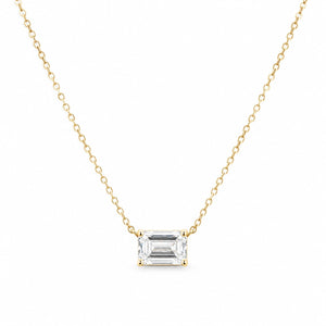 Gold necklace with a rectangular diamond pendant on a white background