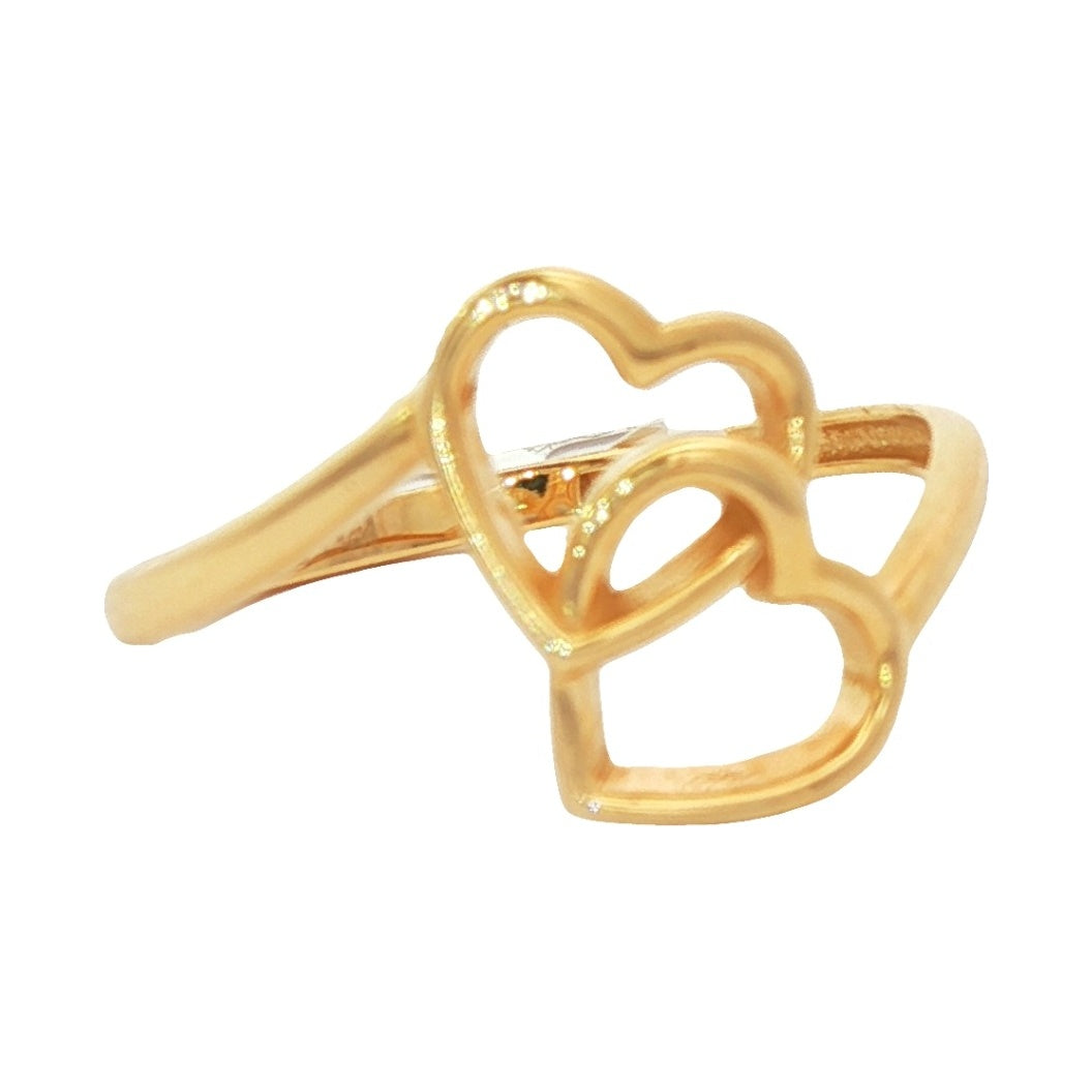 Gold ring with heart design on a white background