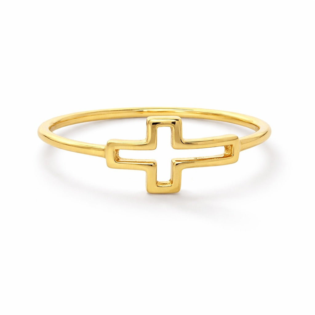 Gold ring with a cross design on a white background