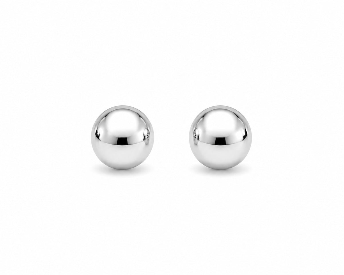 Pair of silver ball earrings on a white background