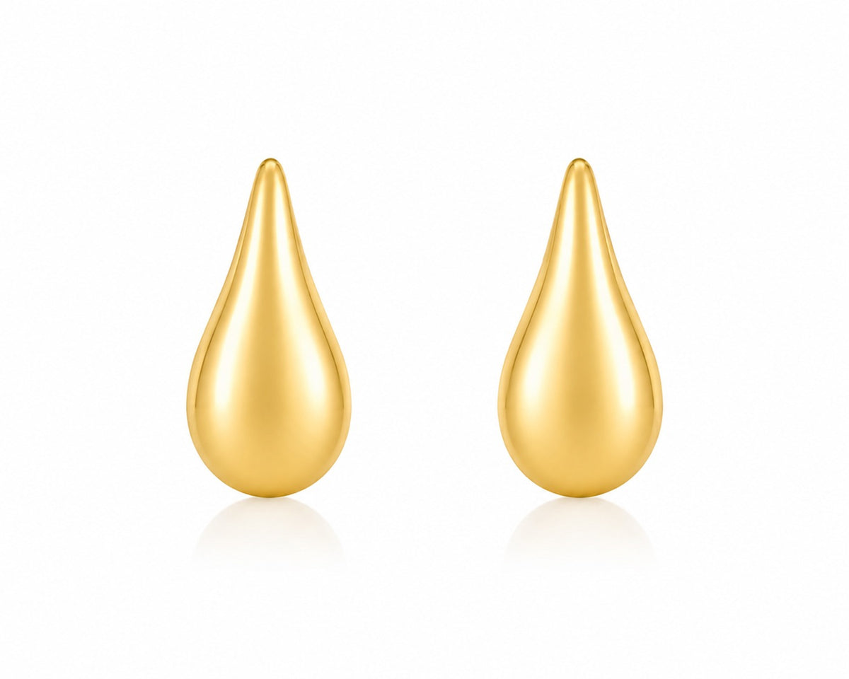 Pair of gold teardrop-shaped earrings on a white background