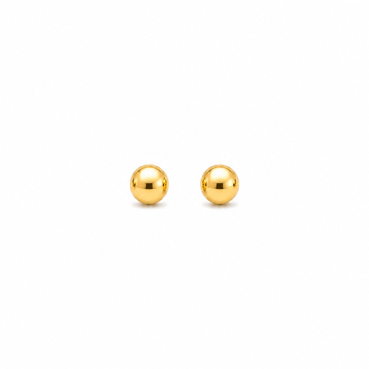 Pair of gold spherical earrings on a white background