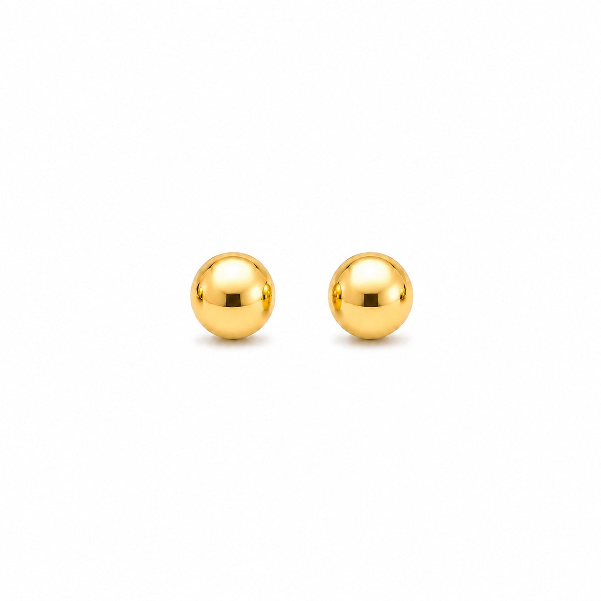 Pair of gold spherical stud earrings on a white background