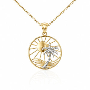Gold necklace with a palm tree and sun pendant on a white background